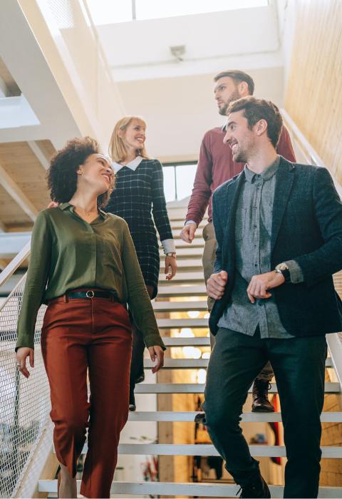 a group of coworkers on stairs