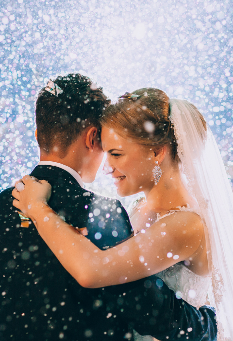 a bride and groom embrace